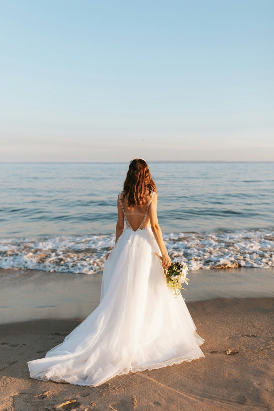 Bride at the shoreline on Riah's beach