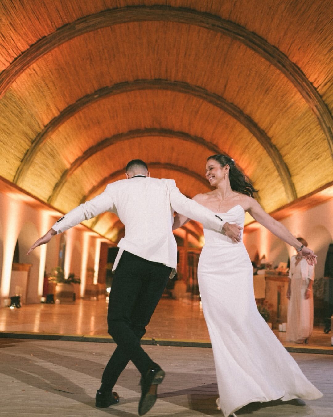 Bride and groom's first dance beneath Riah's bamboo dome