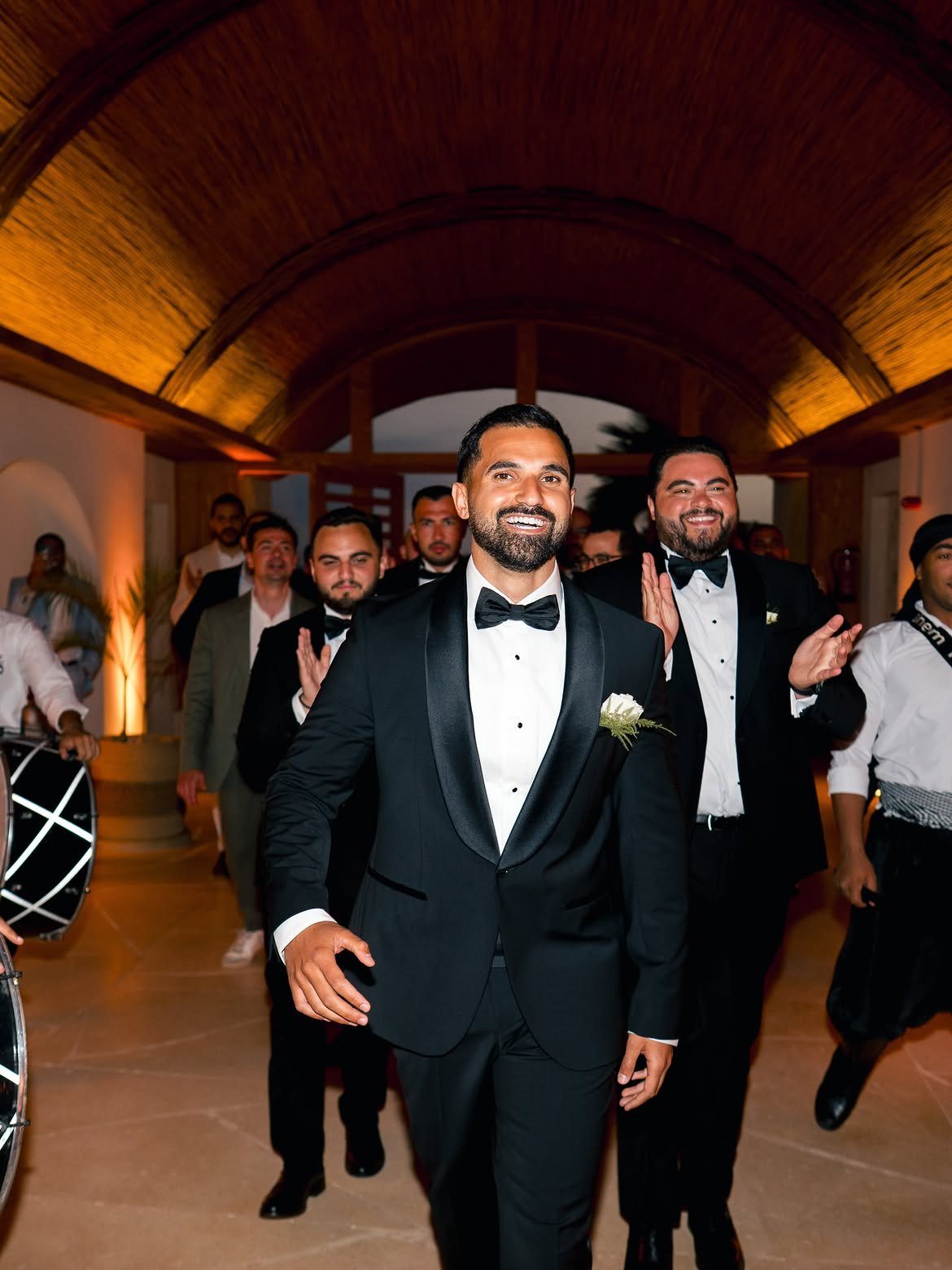 Groom's zaffa entrance with drummers under the dome